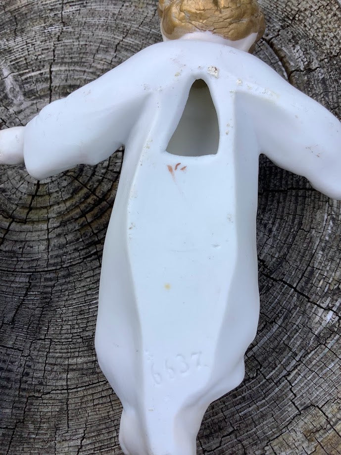 Statue française de Noël en porcelaine représentant l'Enfant Jésus dans une crèche