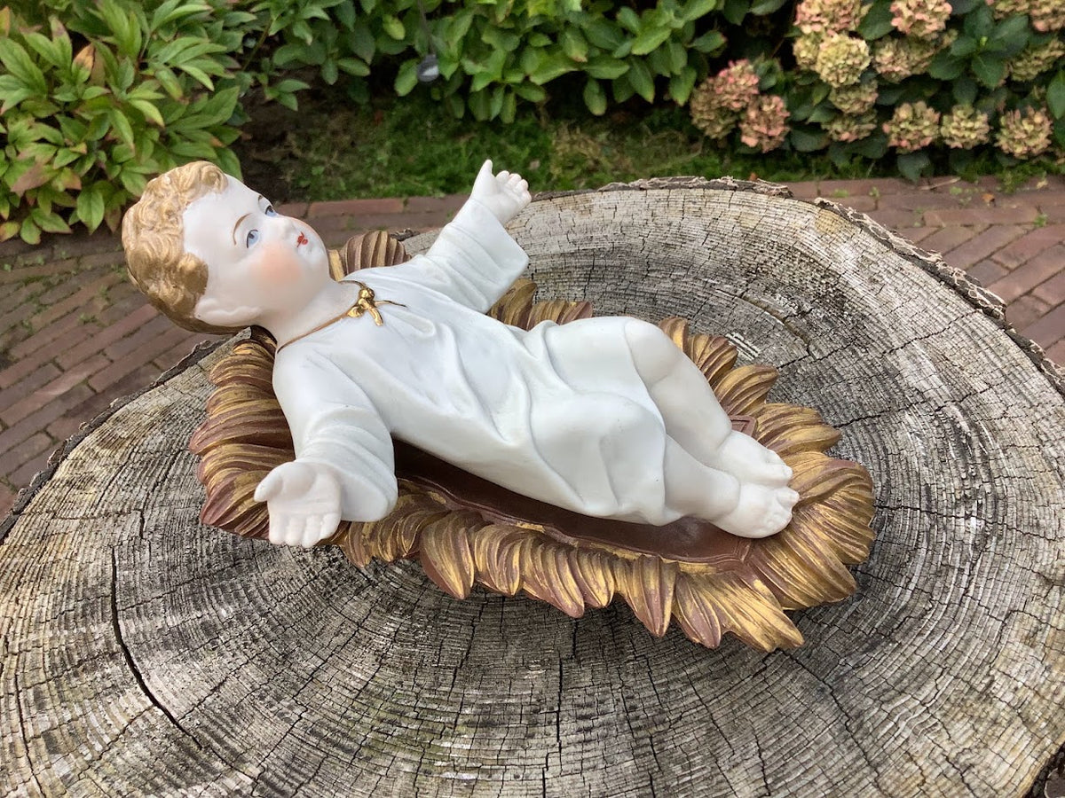 Statue française de Noël en porcelaine représentant l'Enfant Jésus dans une crèche