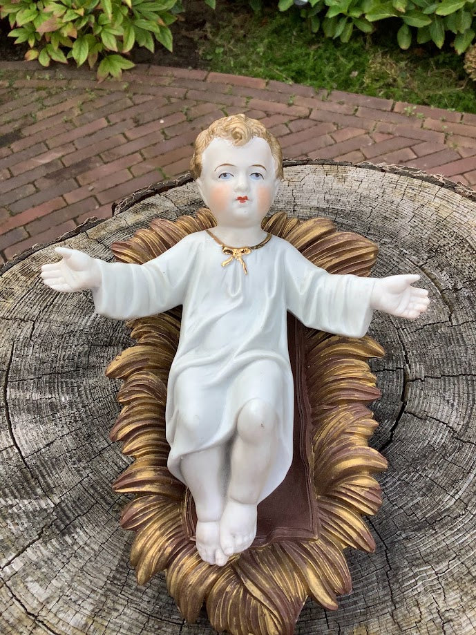 Statue française de Noël en porcelaine représentant l'Enfant Jésus dans une crèche