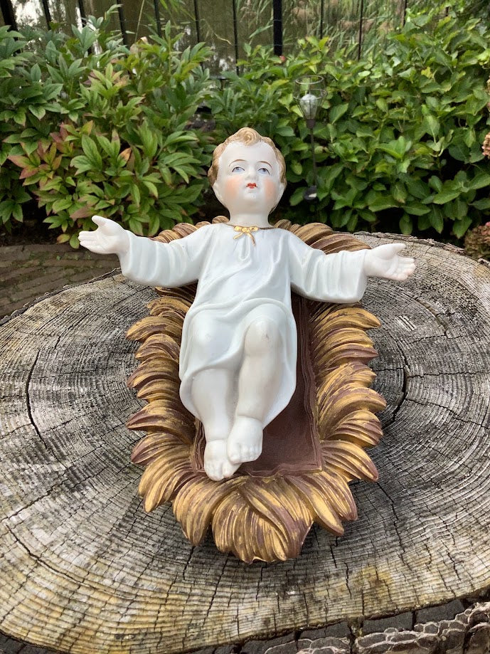 Statue française de Noël en porcelaine représentant l'Enfant Jésus dans une crèche